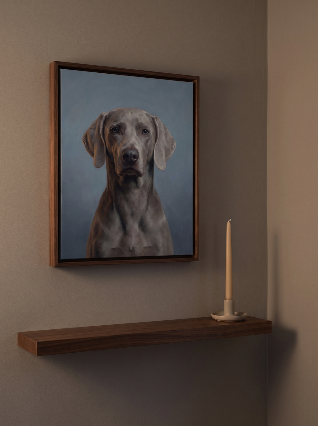 A Forever Dusk memorial portrait framed above a narrow shelf with a candle