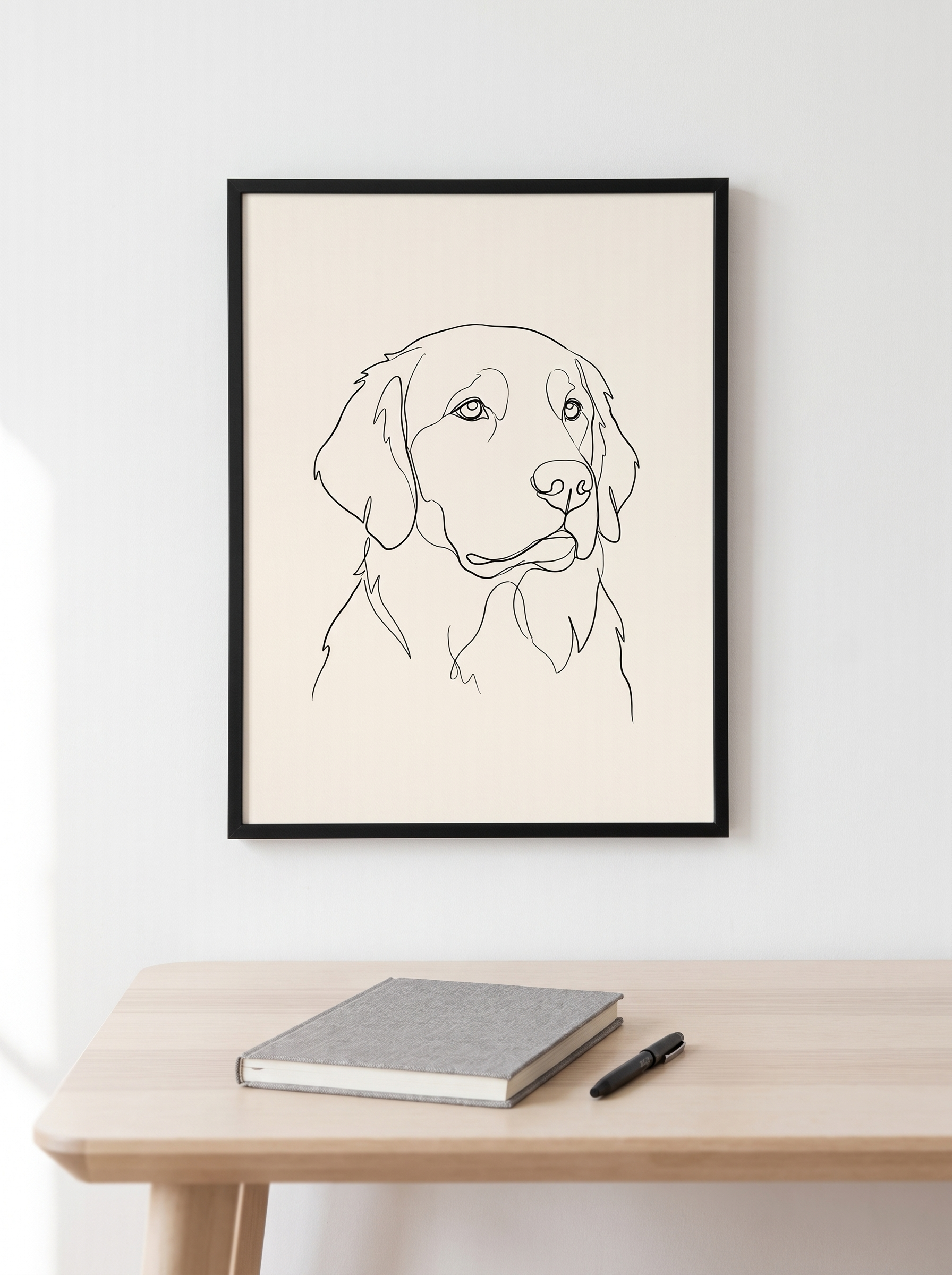 The Studio Line portrait framed above a desk in a bright office