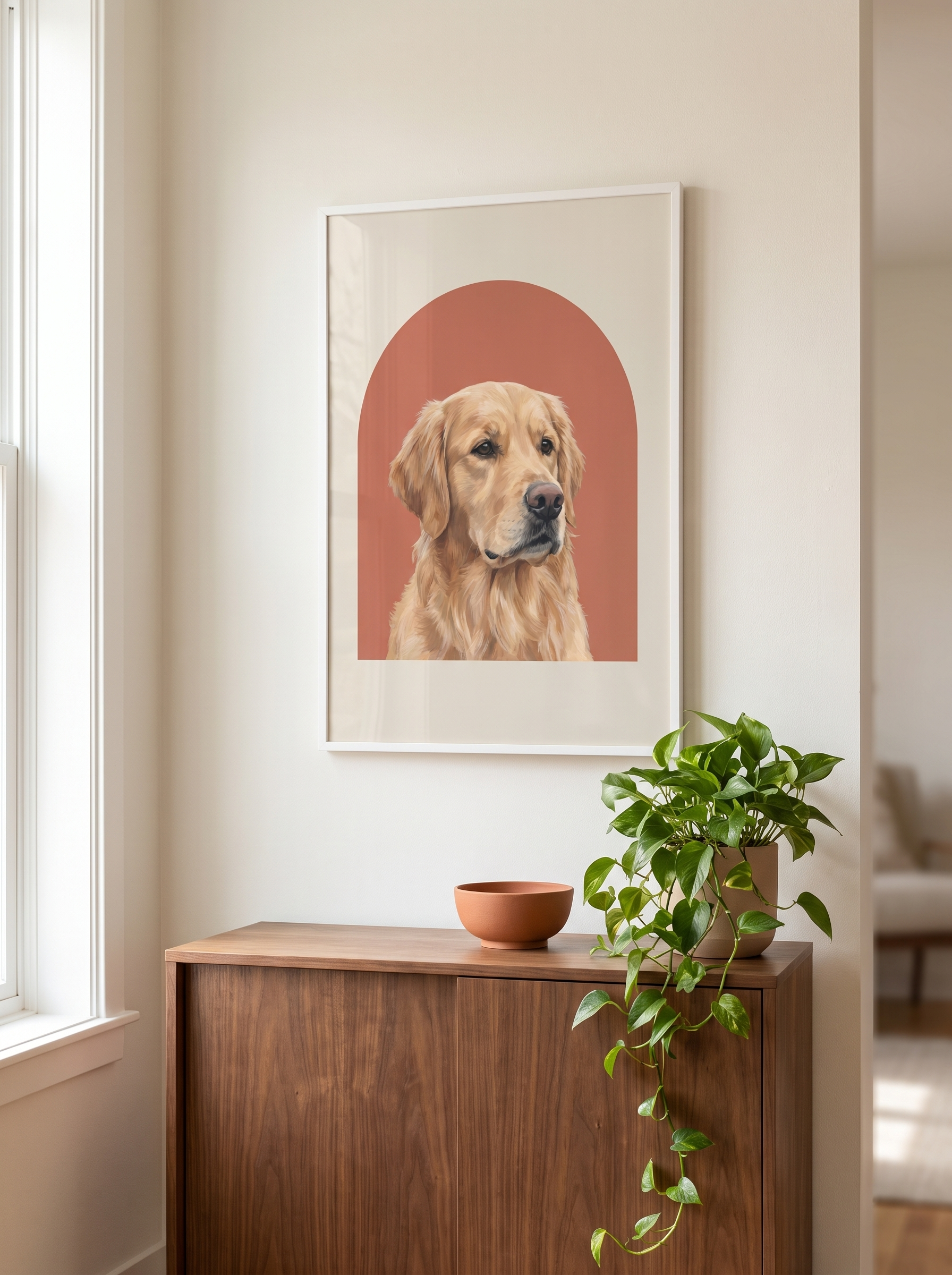 The Studio Arc portrait framed above a walnut sideboard in a living room